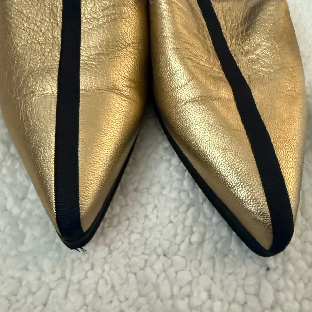 Andre Assoues gold and black slip on pointy style